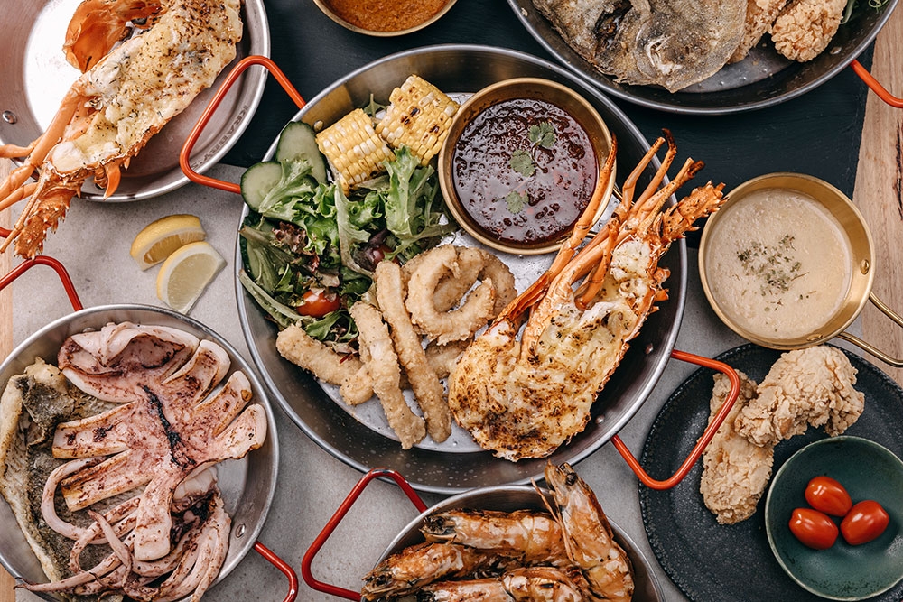Plates of seafood at Krabby’s Crab Boil, The Barracks, Petrie Terrace