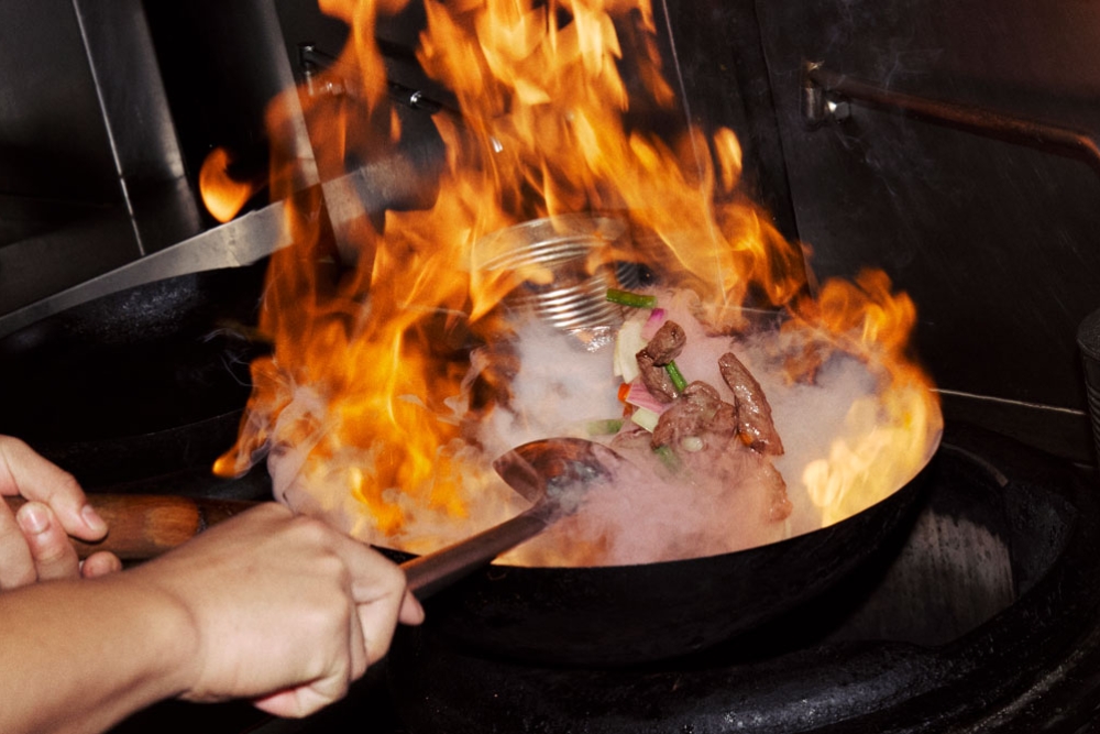 Chef cooking with fire