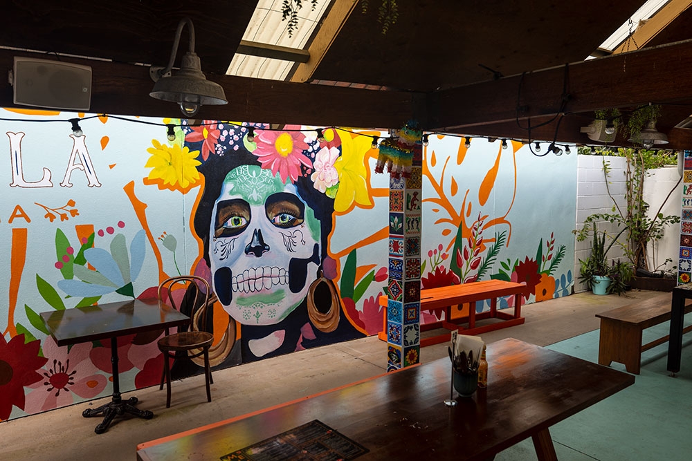 Mexican mural on wall inside La Carmela Petrie Terrace