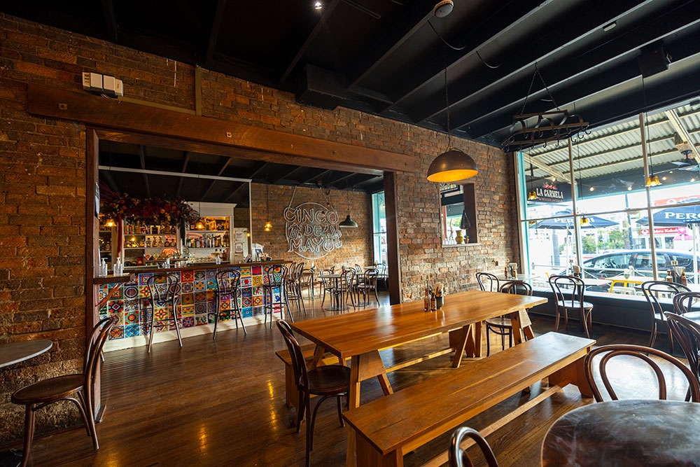 Bar and tables inside La Carmela Petrie Terrace