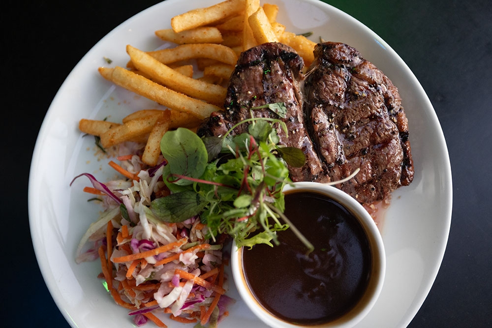 Plate of steak and togerashi fries Last Man Standing Milton