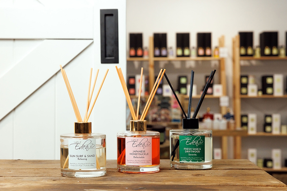Three oil diffusers sitting on the counter inside Lights of Eden home fragrance and gift shop, Albion
