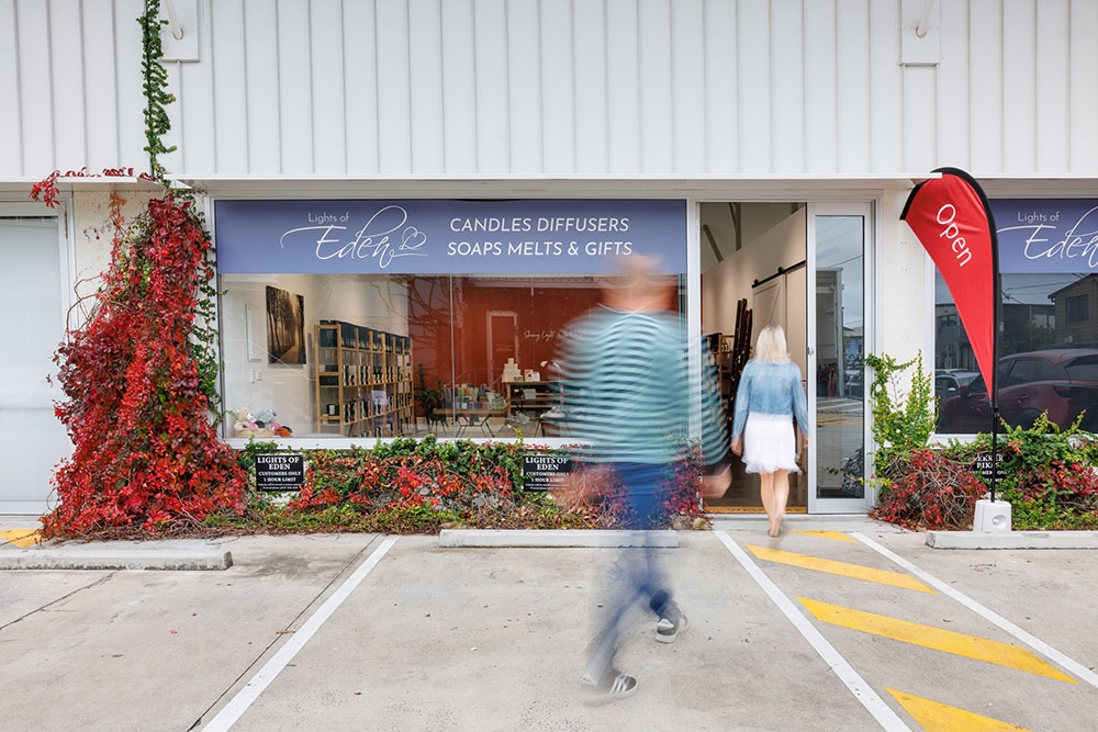Man and woman walking into Lights of Eden home fragrance and gift shop, Albion