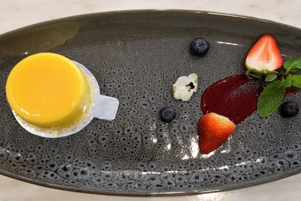 Dessert on a plate with fresh berries at Little Glass Room Espresso Bar, Mt Gravatt