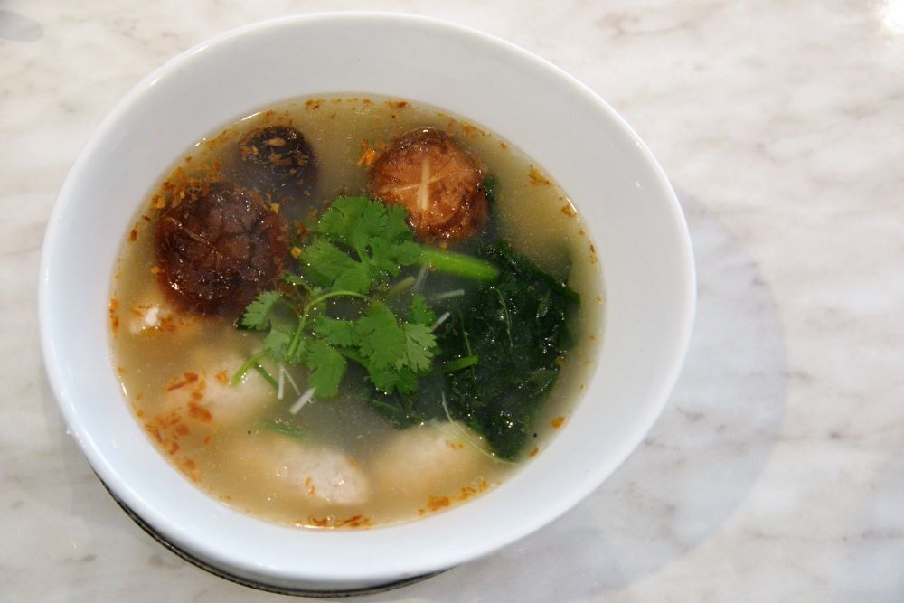 Traditional Thai breakfast rice soup with minced chicken, mushrooms, ginger, coriander and fried garlic at Little Glass Room Espresso Bar, Mt Gravat