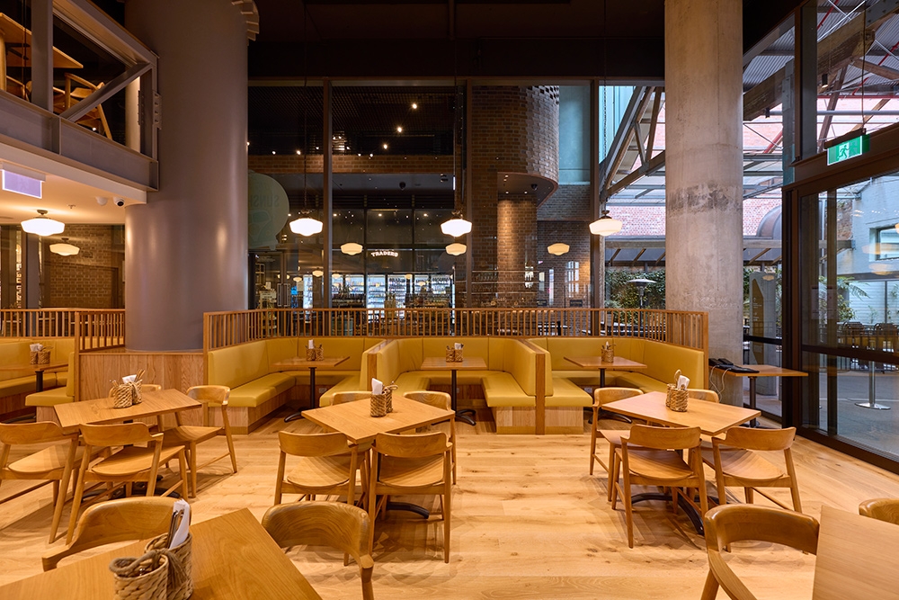 Interior dining with tan chairs at Little Miss Sunshine Brisbane CBD