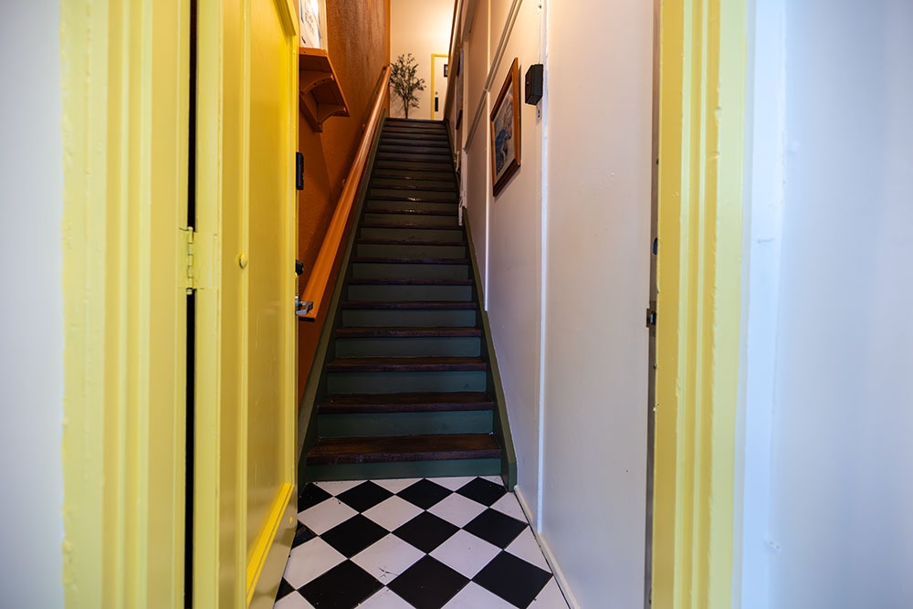Yellow door and staircase Little Provence Brisbane