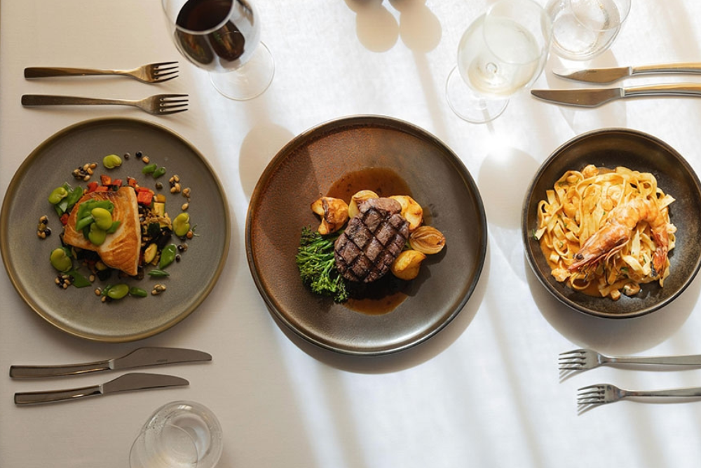 Plates of food on table at Lamberts Restaurant Kangaroo Point