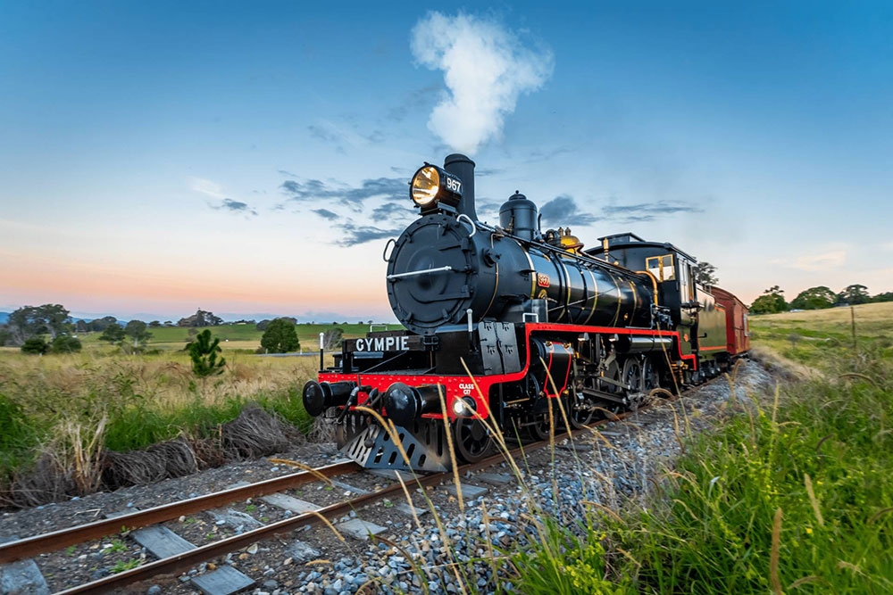 Steam train through valley Mary Valley Rattler 
