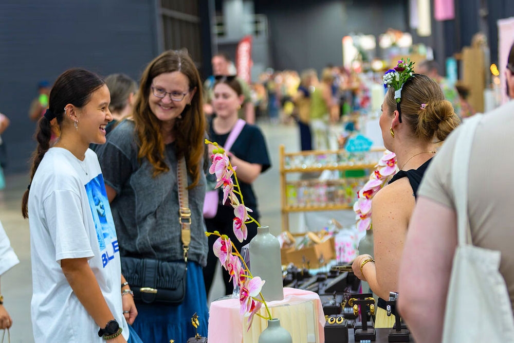 Women browsing stall Christmas Made Local Market