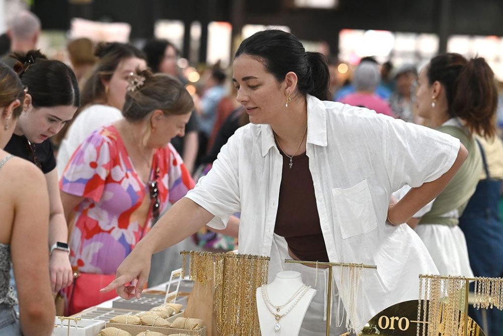 Woman at stall Christmas Made Local Market
