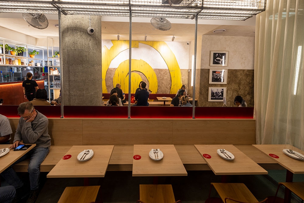 People dining inside Mamak Malaysian Roti & Satay Brisbane CBD