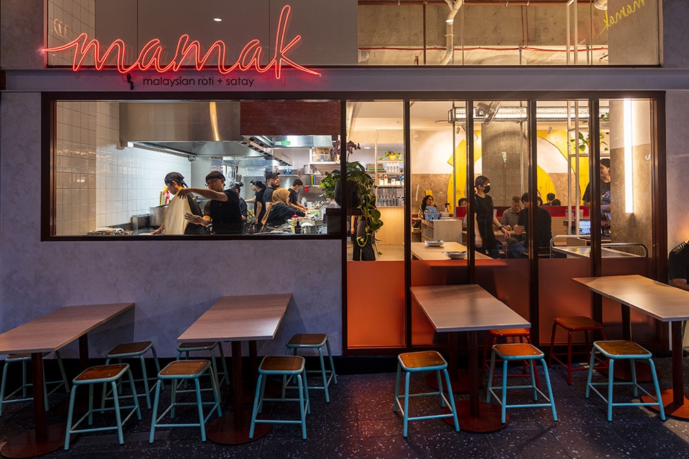 Looking into entrance and kitchen at Mamak Malaysian Roti & Satay Brisbane CBD at night