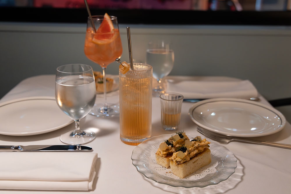 Drinks and crab brioche on table at Marlowe