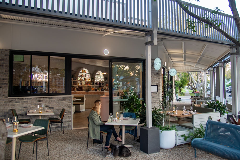Chairs and tables on terrace of Mede Restaurant, Bulimba
