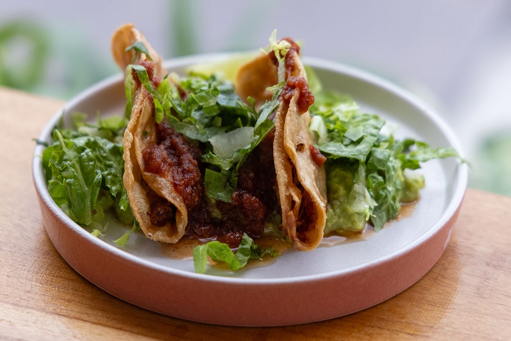 Two tacos on plate at Mexicali Bar Y Taqueria Bulimba 