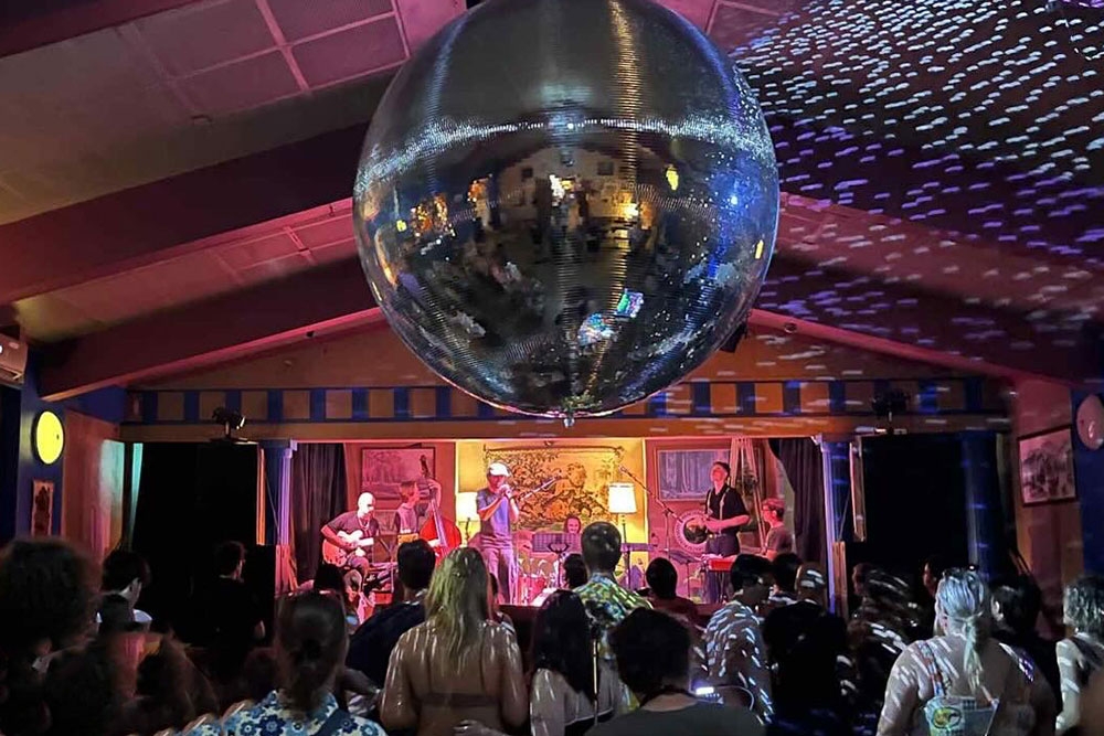 Crowd dancng under mirror ball Mirrorball Ministries