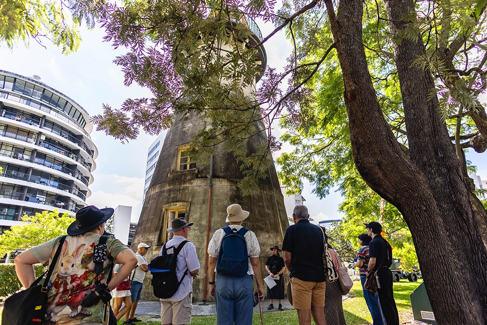 People in front of windmill Convict Brisbane Walking Tour