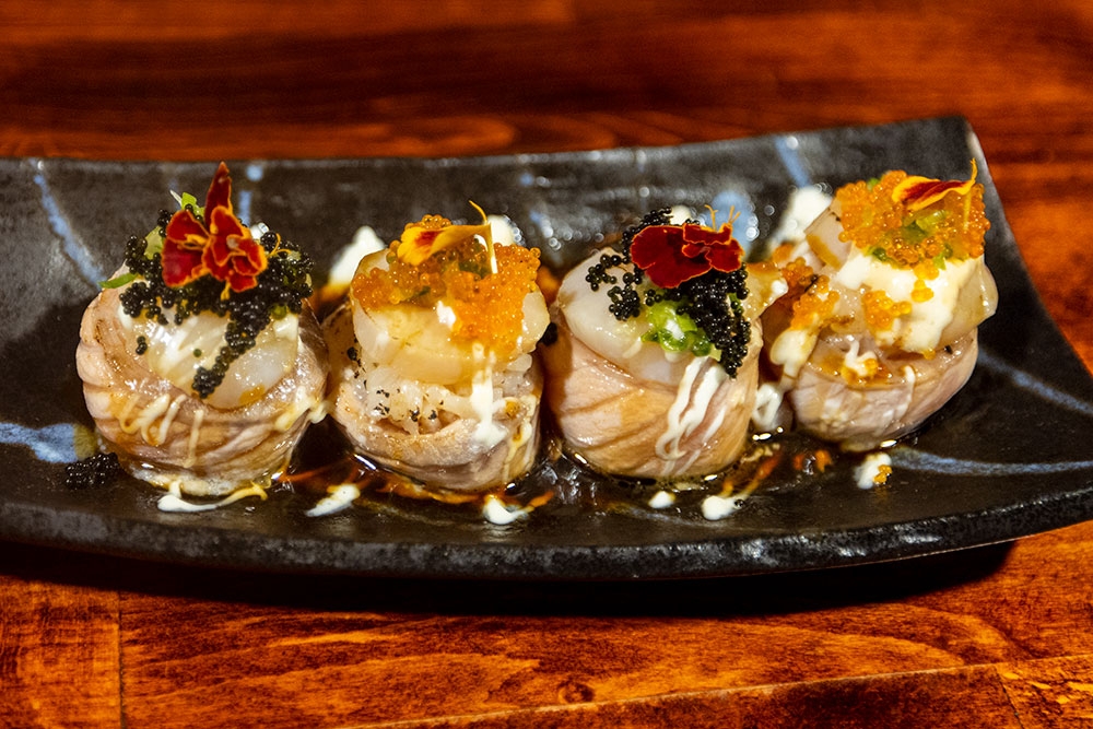 Flamed salmon with Hokkaido scallops, mayonnaise, cucumber, grilled teriyaki and fried shallots at Mobo Japanese Kangaroo Point