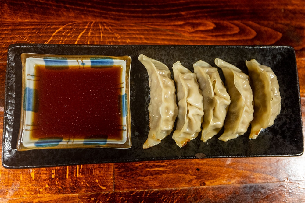 Gyoza on a plate with sauce at Mobo Japanese Kangaroo Point