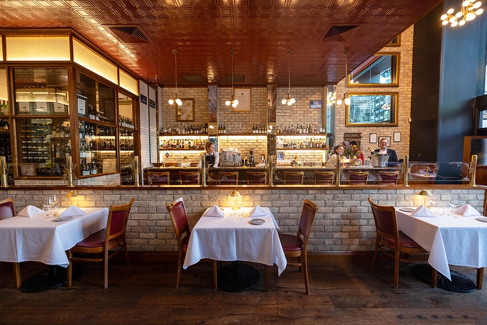 White clothed table inside Montrachet at Bowen Hills