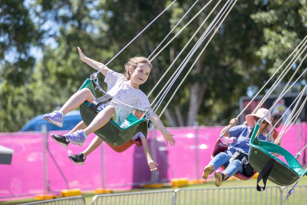 Kids on a big swing ride, Moreton Kids Festival