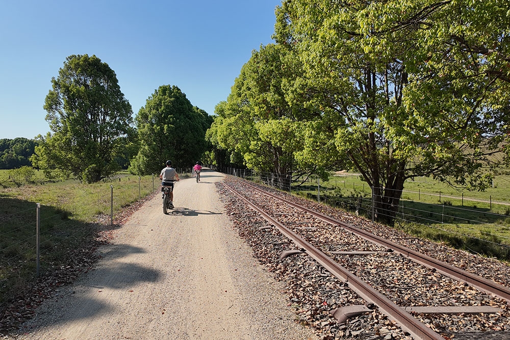Cyclist on e-bike on the rail trail 