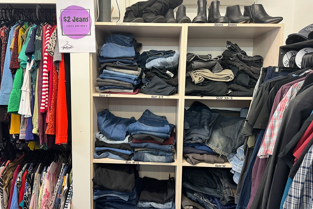 Racks and shelves of secondhand clothes for sale at My Preloved Wardrobe Exchange, Clontarf, Moreton Bay, Brisbane, Queensland