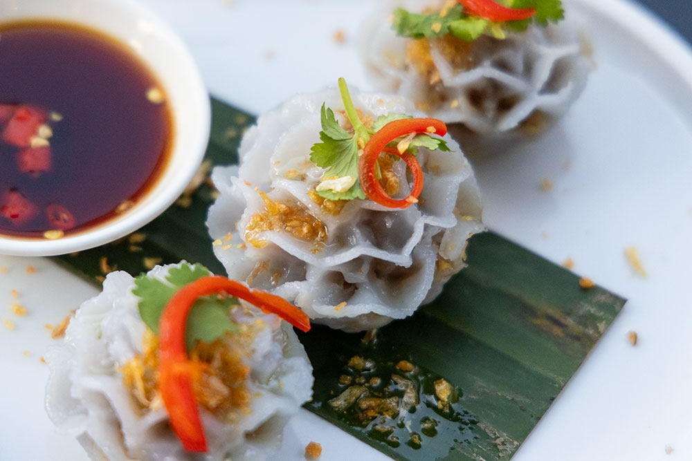 Flower dim sims (winter melon, roast peanut & sesame, fried garlic and caramelised chilli vinegar) at Naga Thai South Bank