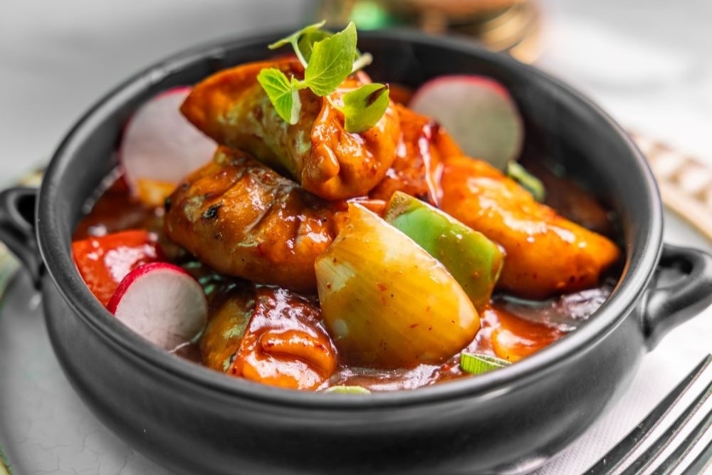 Dumplings in sauce in a bowl New Farm Curry House 