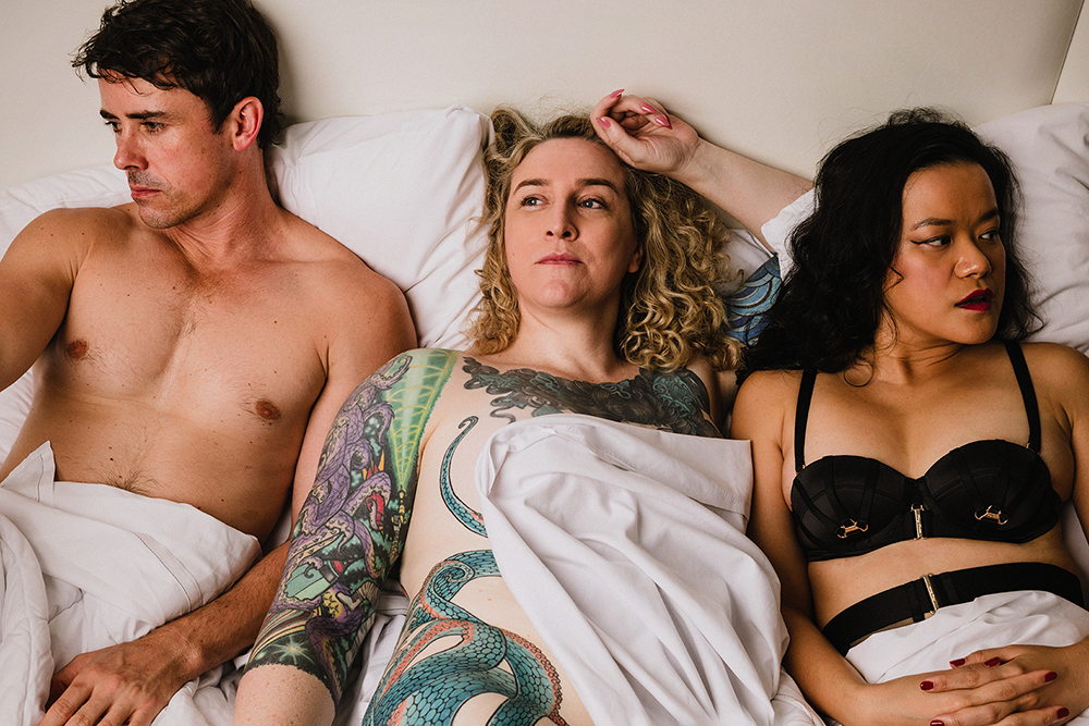 3 performers laying in bed Melt Festival 