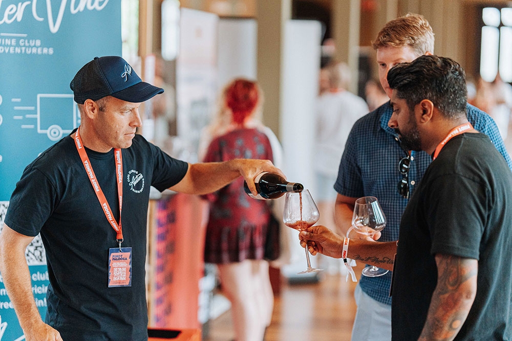 People tastign wine at cheese & wine festival