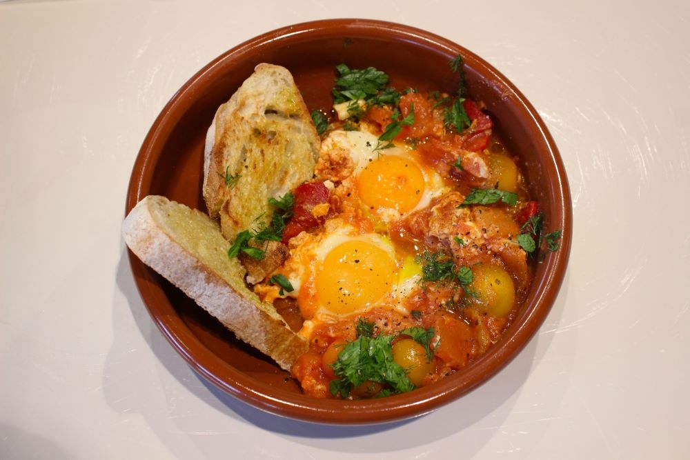 Bowl of shakshuka Middle Eastern baked eggs at Pablo's Pantry, Woolloongabba