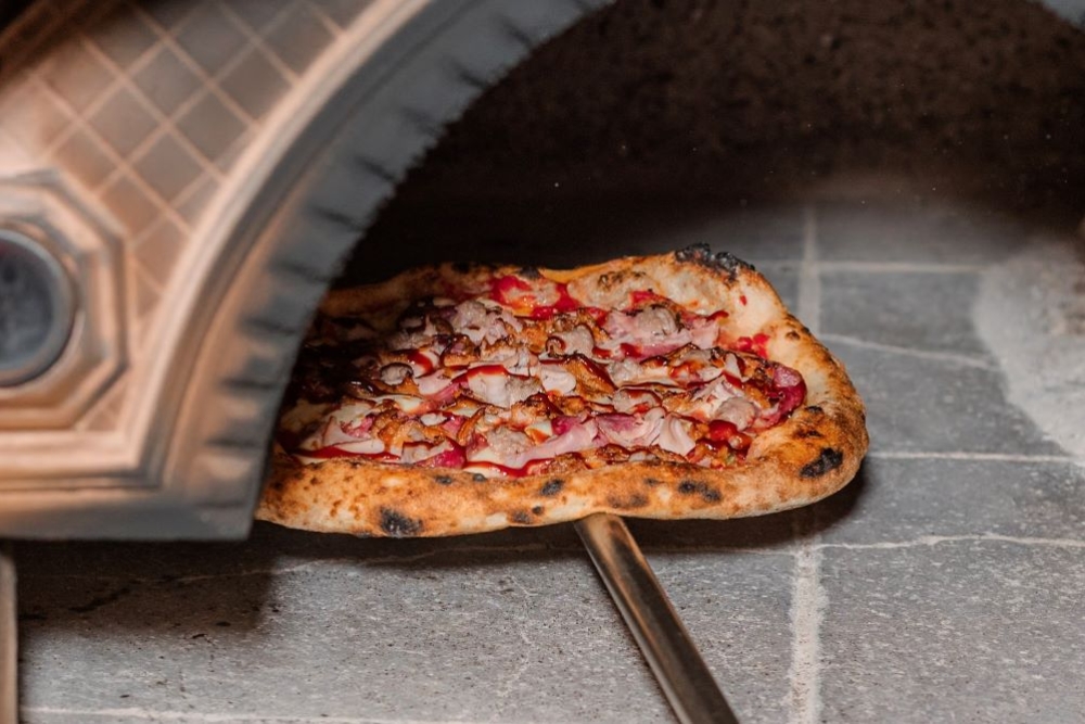 Pizza in oven at Paninni's Italian Restaurant 