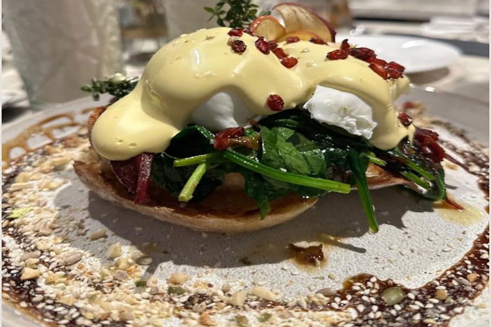Mediterranean Benedict (poached eggs, spinach, caramelised onion, yoghurt & chilli burnt butter) at Pera Palace Wynnum