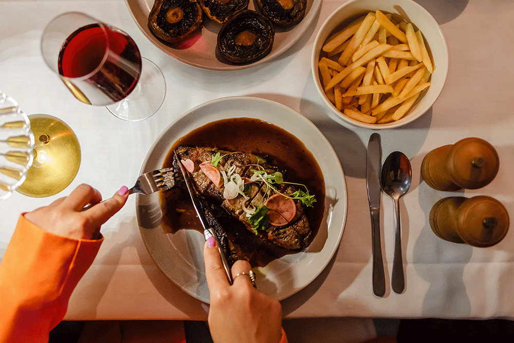 Food on plates at Hepburn's Steakhouse Wynnum