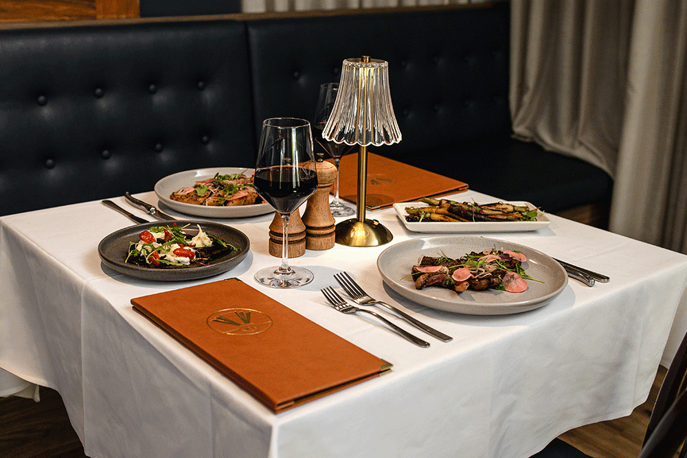 A table set with food at Hepburn's Steakhouse Wynnum