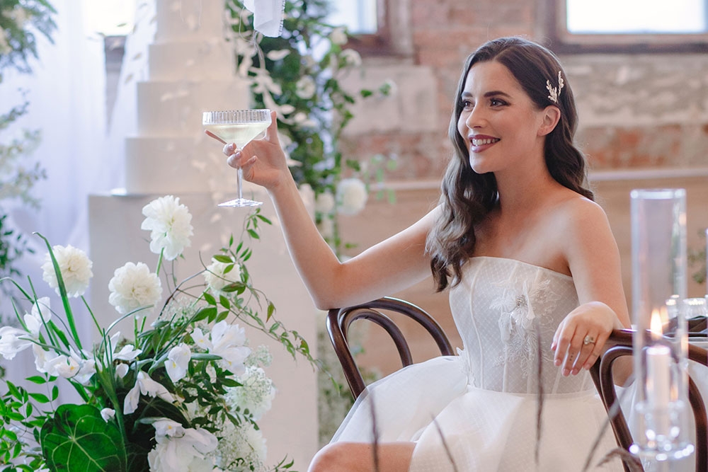 Bride posing with flowers