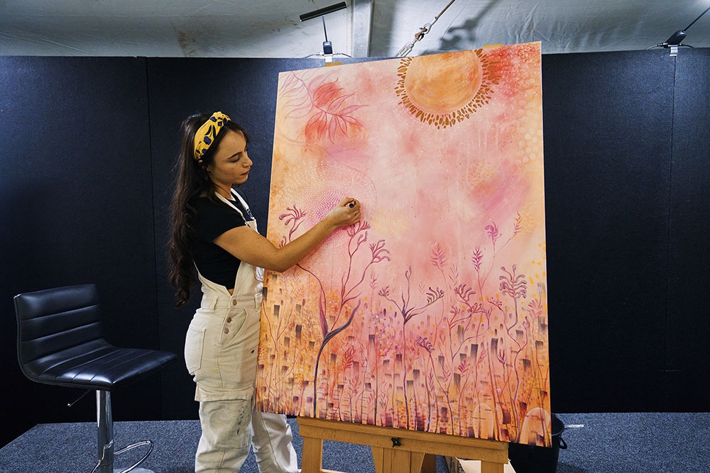Artist painting Recovered Futures Art Exhibition Brisbane City