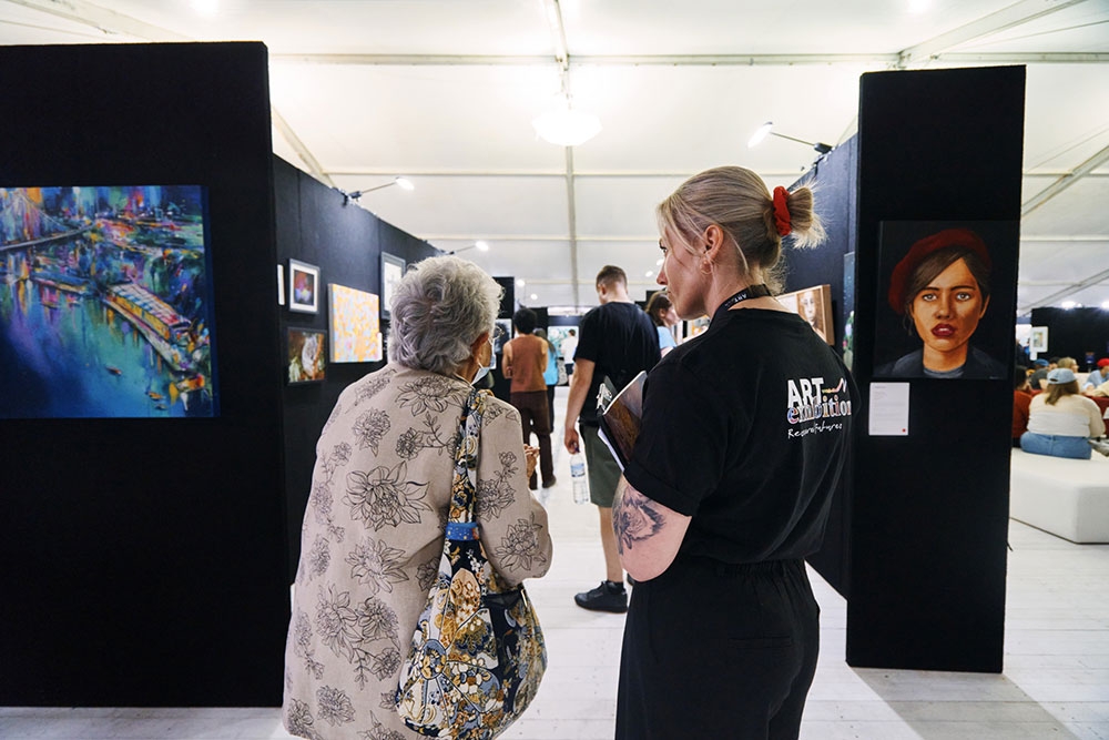 Person at entrance to exhibition Recovered Futures Art Exhibition Brisbane City