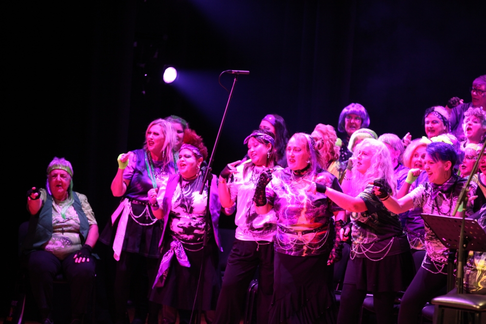 choir performers singing into microphone 