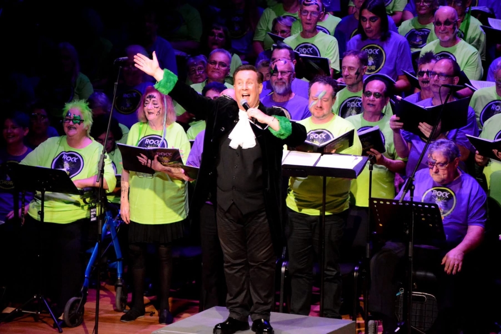 Choir performance with conductor 