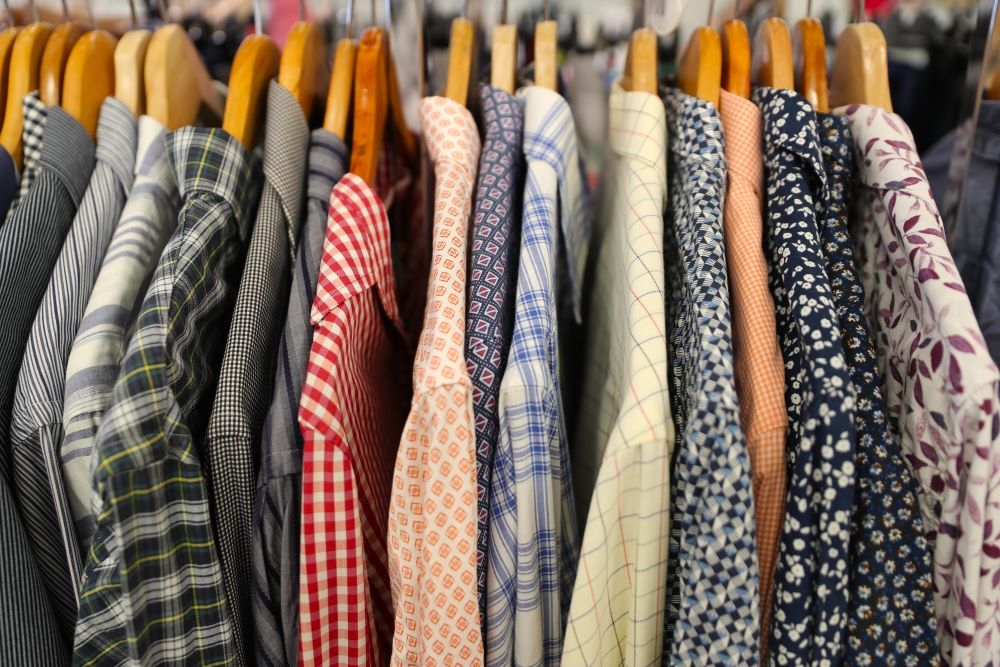 Rack of secondhand clothes for sale inside RSPCA Op Shop, New Farm  