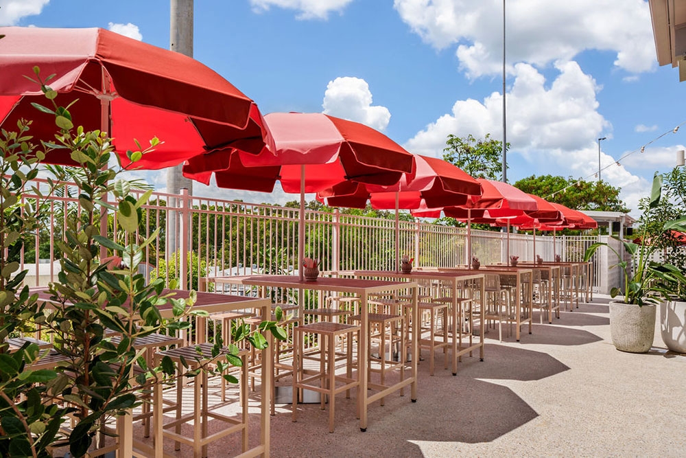 Red umbrellas in courtyard Everton Park Hotel