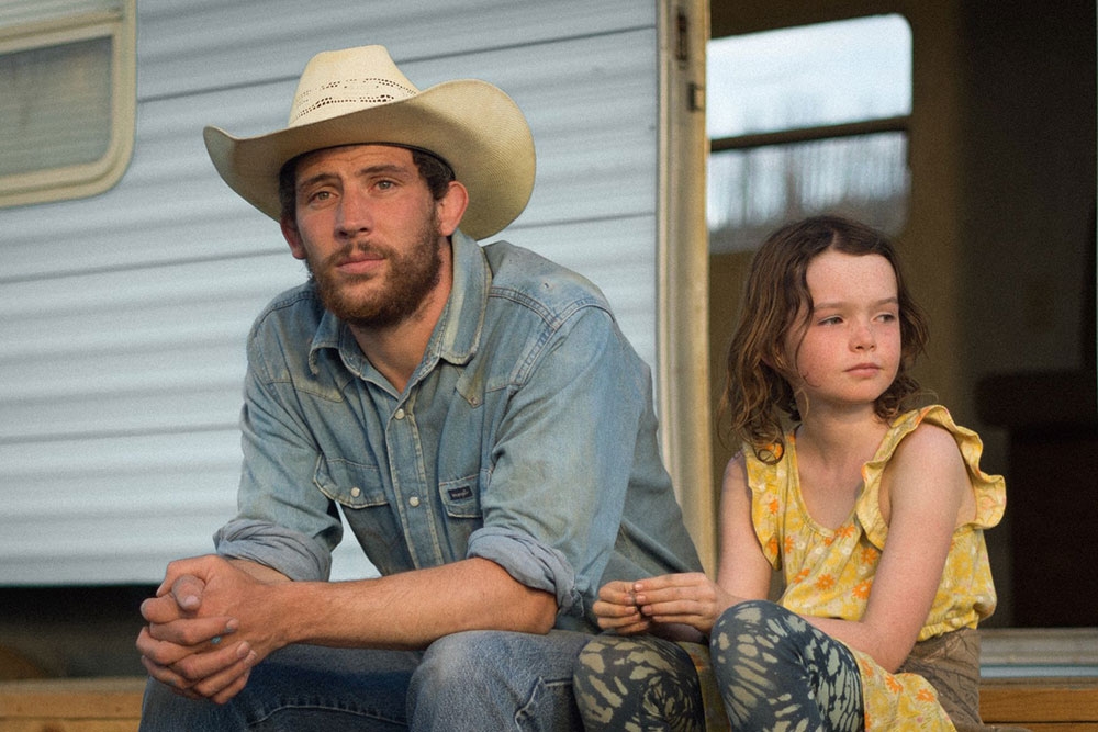 Scene of a man wearing a cowboy hat and a girl sitting down in the Rebuilding movie at the Brisbane International Film Festival 2025