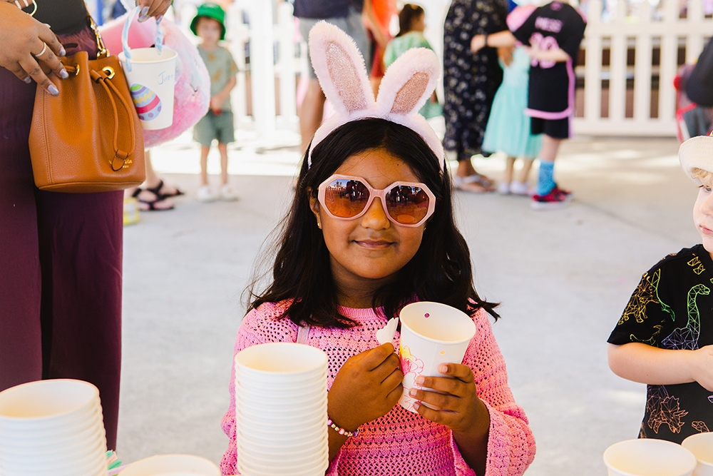 Child wearing bunny ears at the Redcliffe Markets Easter Extravaganza