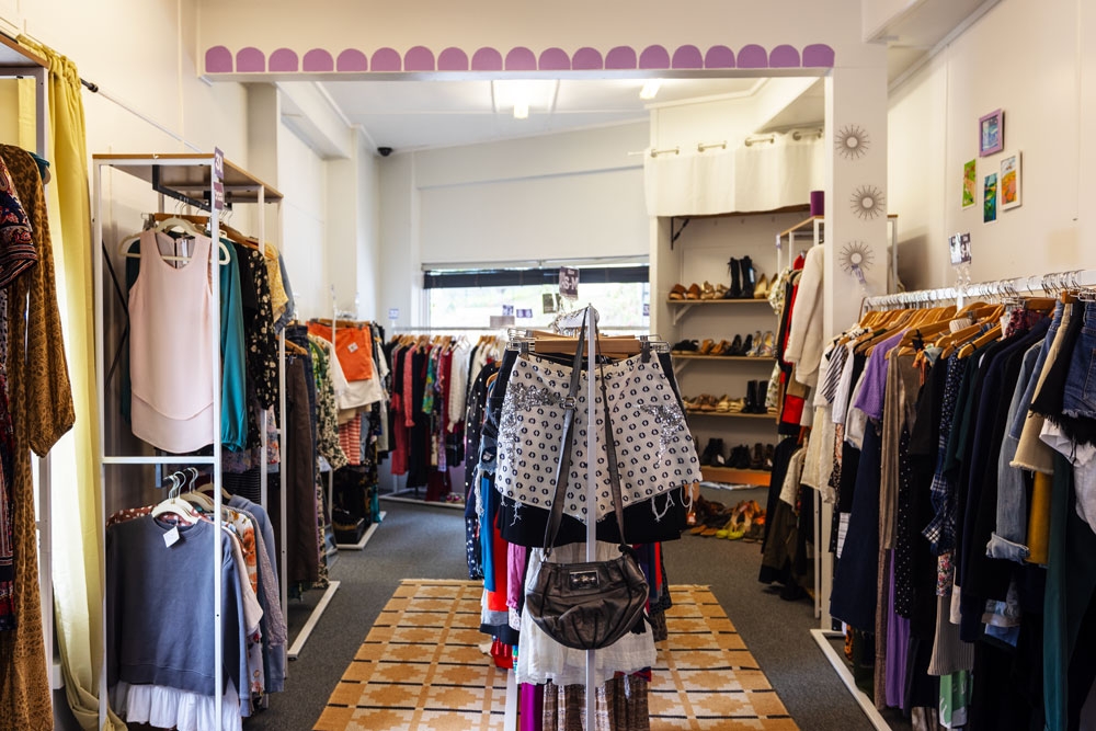 Racks of secondhand clothing at Round Two Preloved Clothing Norman Park