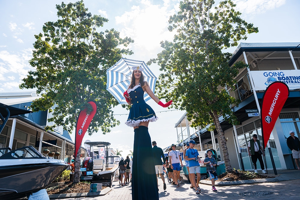 Stilt walker in street Sanctuary Cove International Boat Show