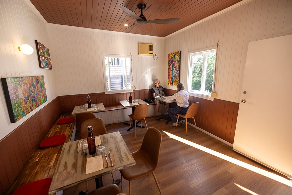 tables and chairs inside Salud Auchenflower