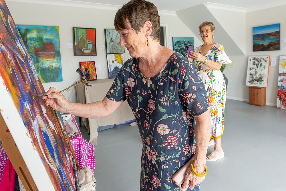 Lady painting on a canvas 